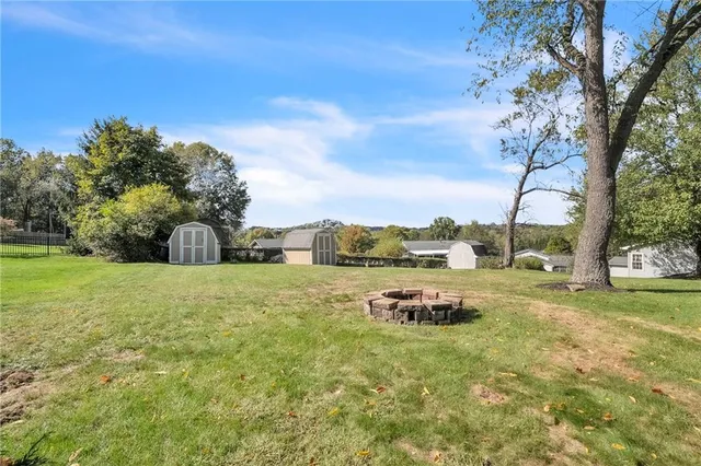a view of a garden with lawn chairs