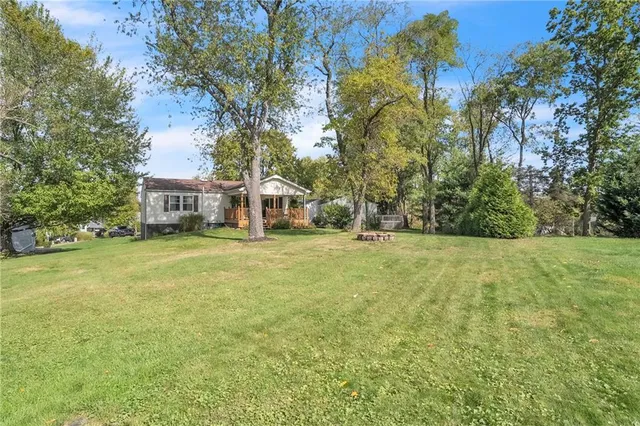 a view of house with outdoor space and garden