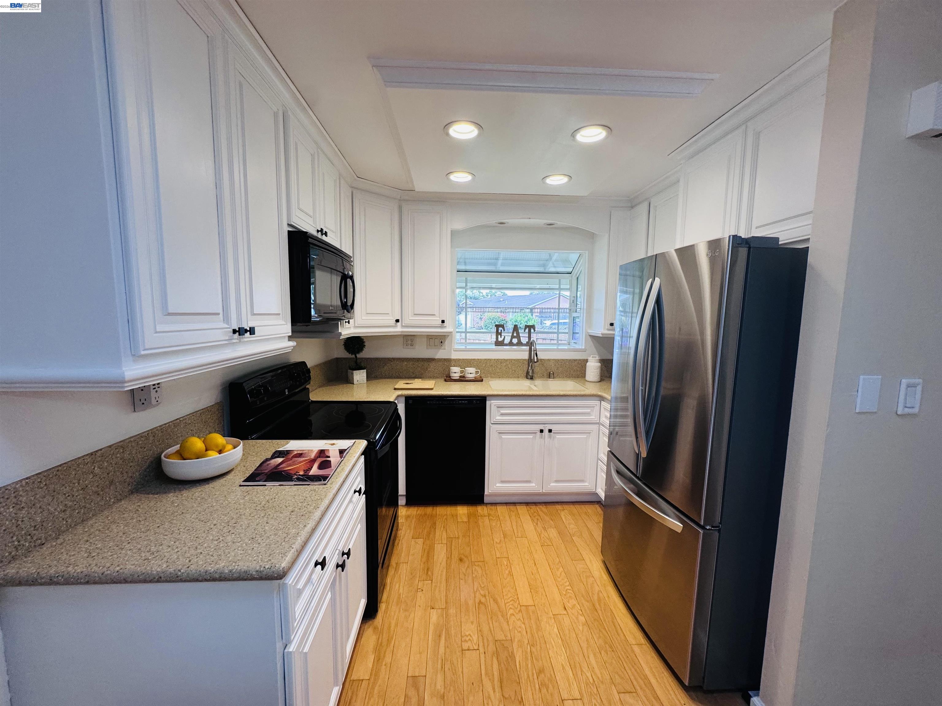32301 Ruth Court Union City, CA 94587 - Photo 4 of 32 a kitchen with stainless steel appliances granite countertop a refrigerator sink and microwave
