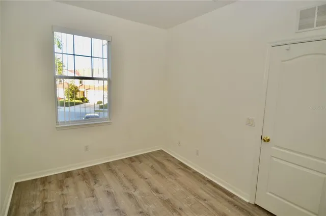 a view of an empty room with a window