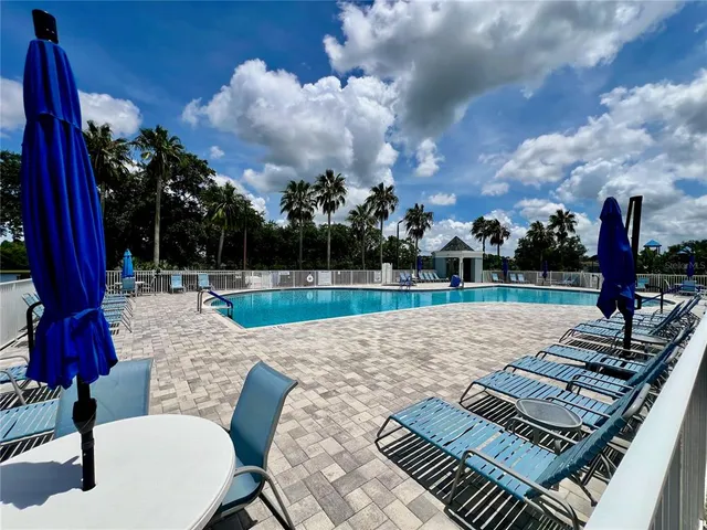 a view of a backyard with furniture and a backyard