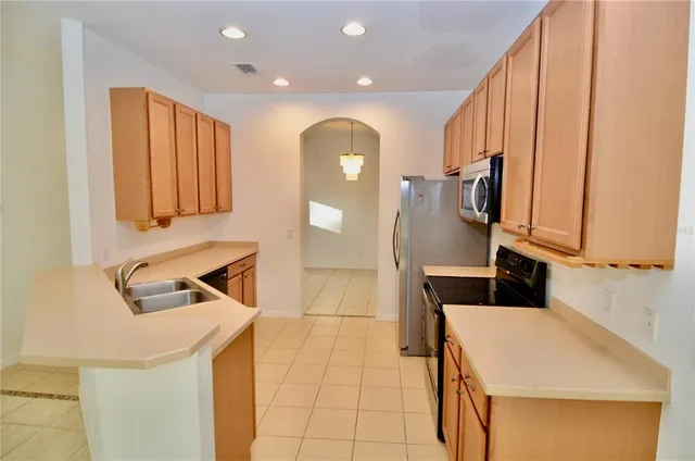 a bathroom with a sink a mirror and shower