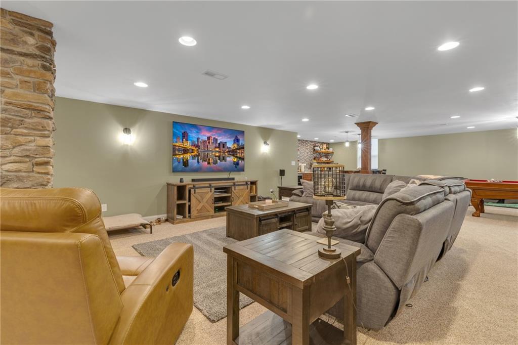 125 James Drive Beaver, PA 15009 - Photo 19 of 40 a living room with furniture a flat screen tv and a large window