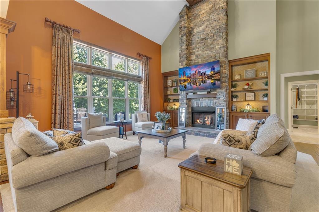 125 James Drive Beaver, PA 15009 - Photo 2 of 40 a living room with furniture a fireplace and a large window