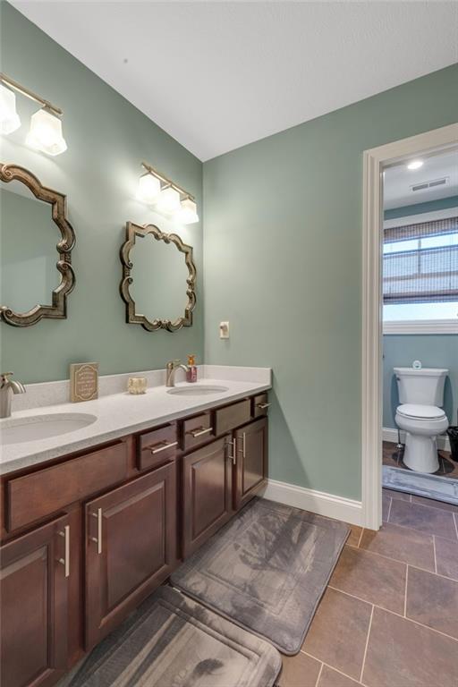 125 James Drive Beaver, PA 15009 - Photo 31 of 40 a spacious bathroom with a double vanity sink and a mirror
