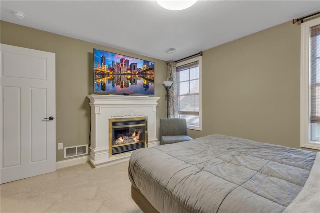 125 James Drive Beaver, PA 15009 - Photo 33 of 40 a bed room with a bed and a fireplace