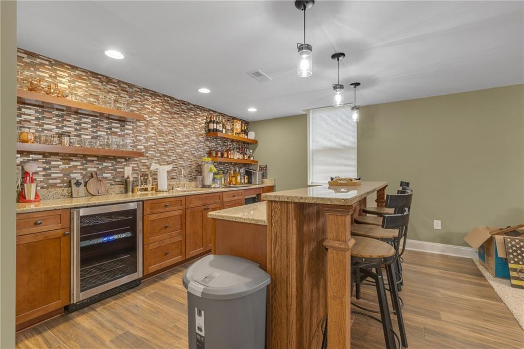 125 James Drive Beaver, PA 15009 - Photo 7 of 40 a kitchen with stainless steel appliances granite countertop a sink and wooden floor