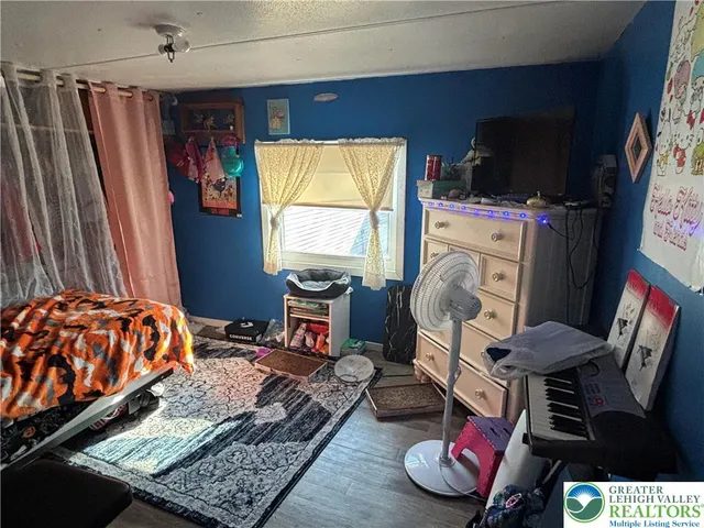 a bed room with a bed and a window