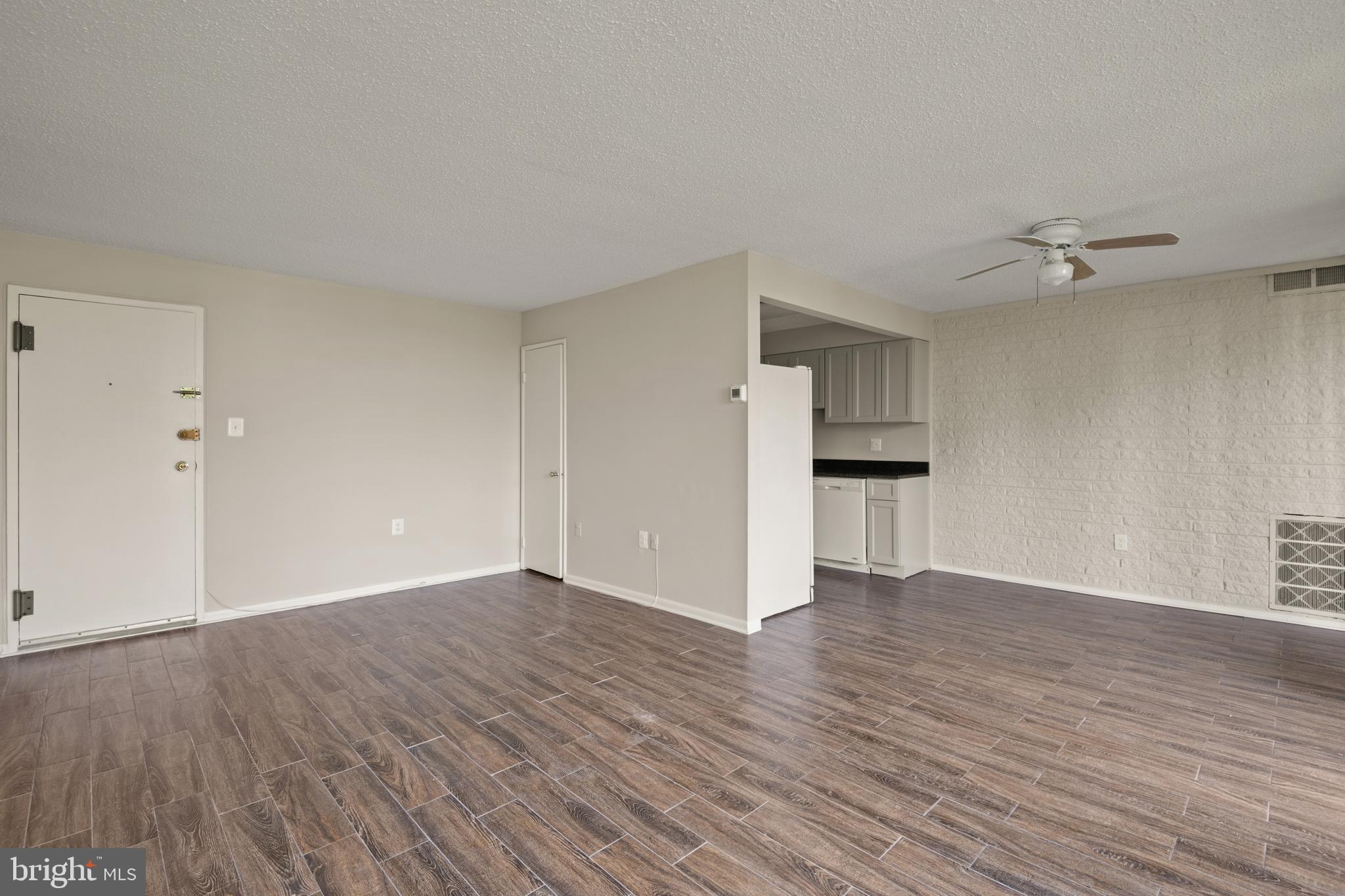 1824 Metzerott Road, Unit 303 Adelphi, MD 20783 - Photo 8 of 28 a view of empty room with wooden floor