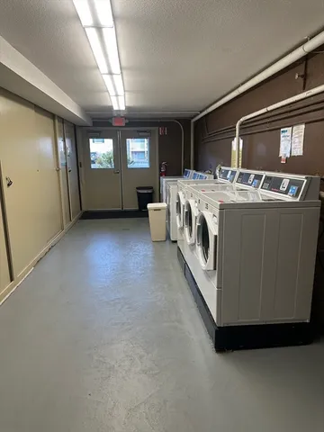 a view of living room with furniture and windows