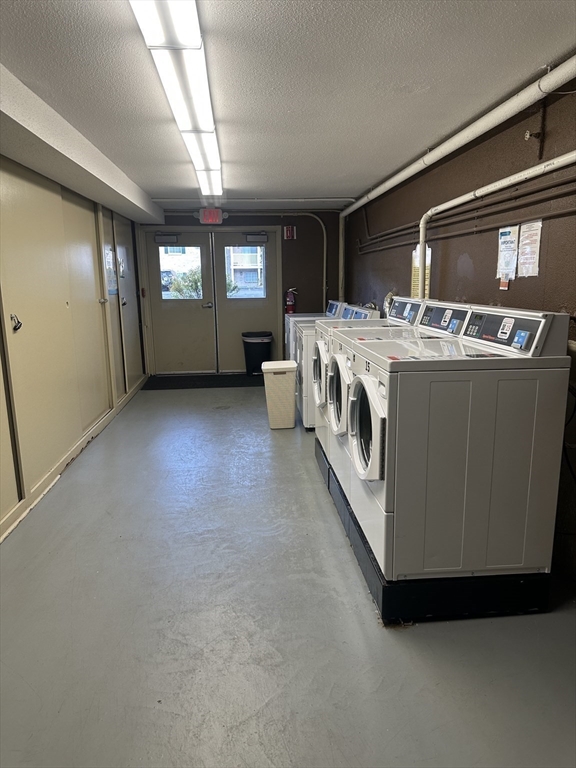200 Manning Street, Unit 6C Hudson, MA 01749 - Photo 5 of 6 a view of living room with furniture and windows