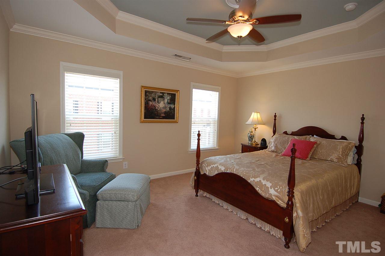 1304 Still Monument Way Raleigh, NC 27603 - Photo 14 of 20 a bedroom with a bed and window