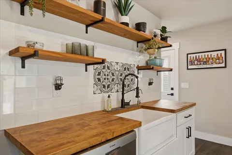 a room with a refrigerator and cabinets