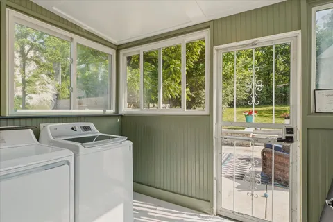 a view of a room that has a bed and a view of outdoor space