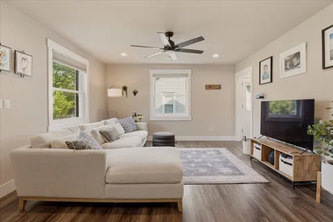a living room with furniture and a flat screen tv