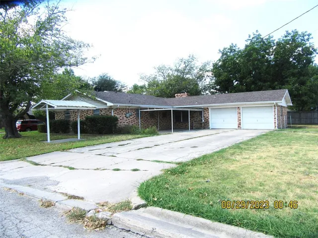 a house view with a garden space