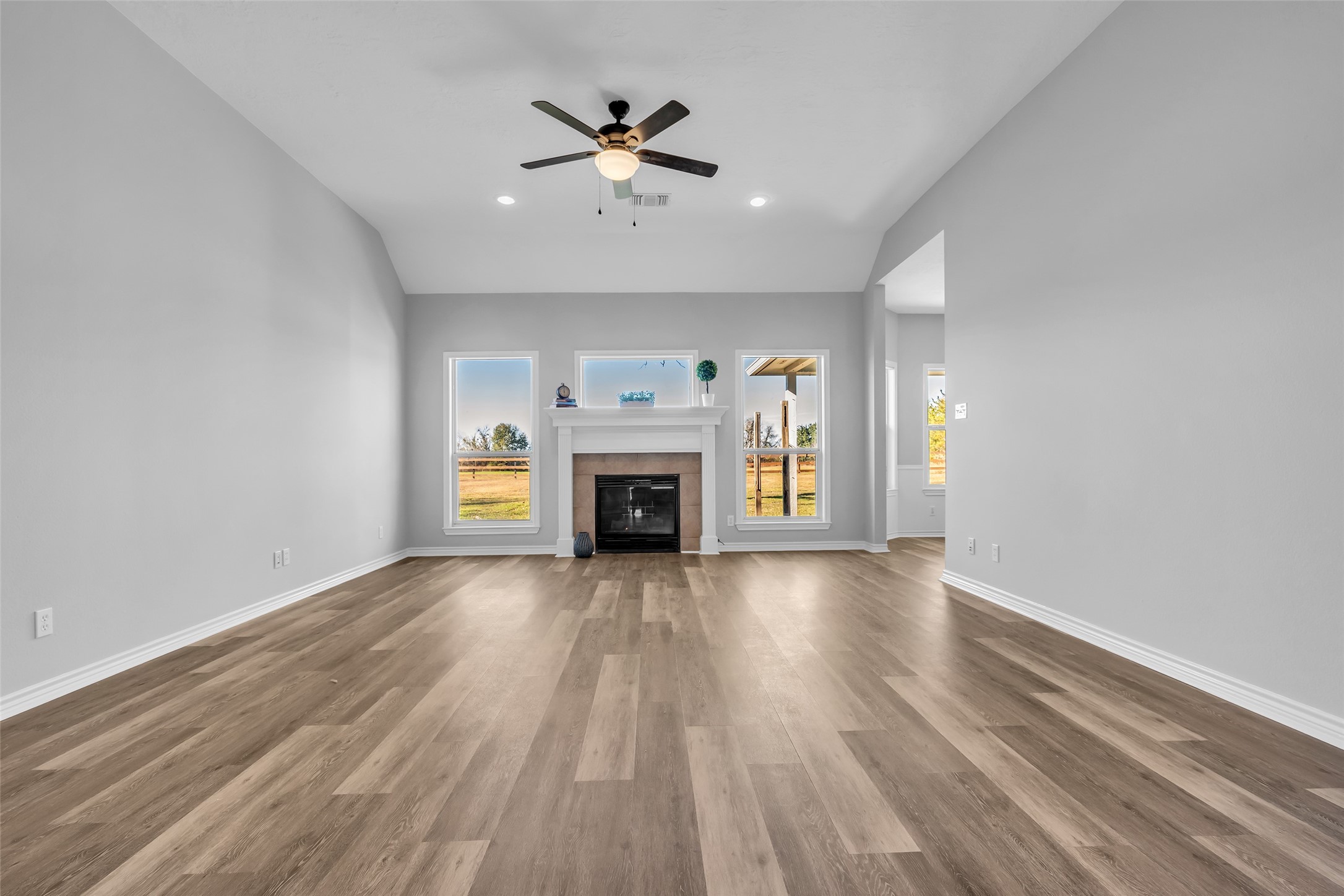 1075 Harrisburg Road Brenham, TX 77833 - Photo 11 of 49 an empty room with windows fireplace and a sink