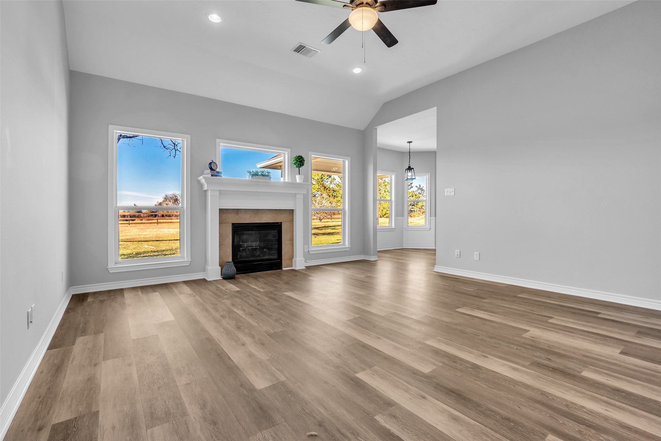 1075 Harrisburg Road Brenham, TX 77833 - Photo 13 of 49 an empty room with windows and fireplace