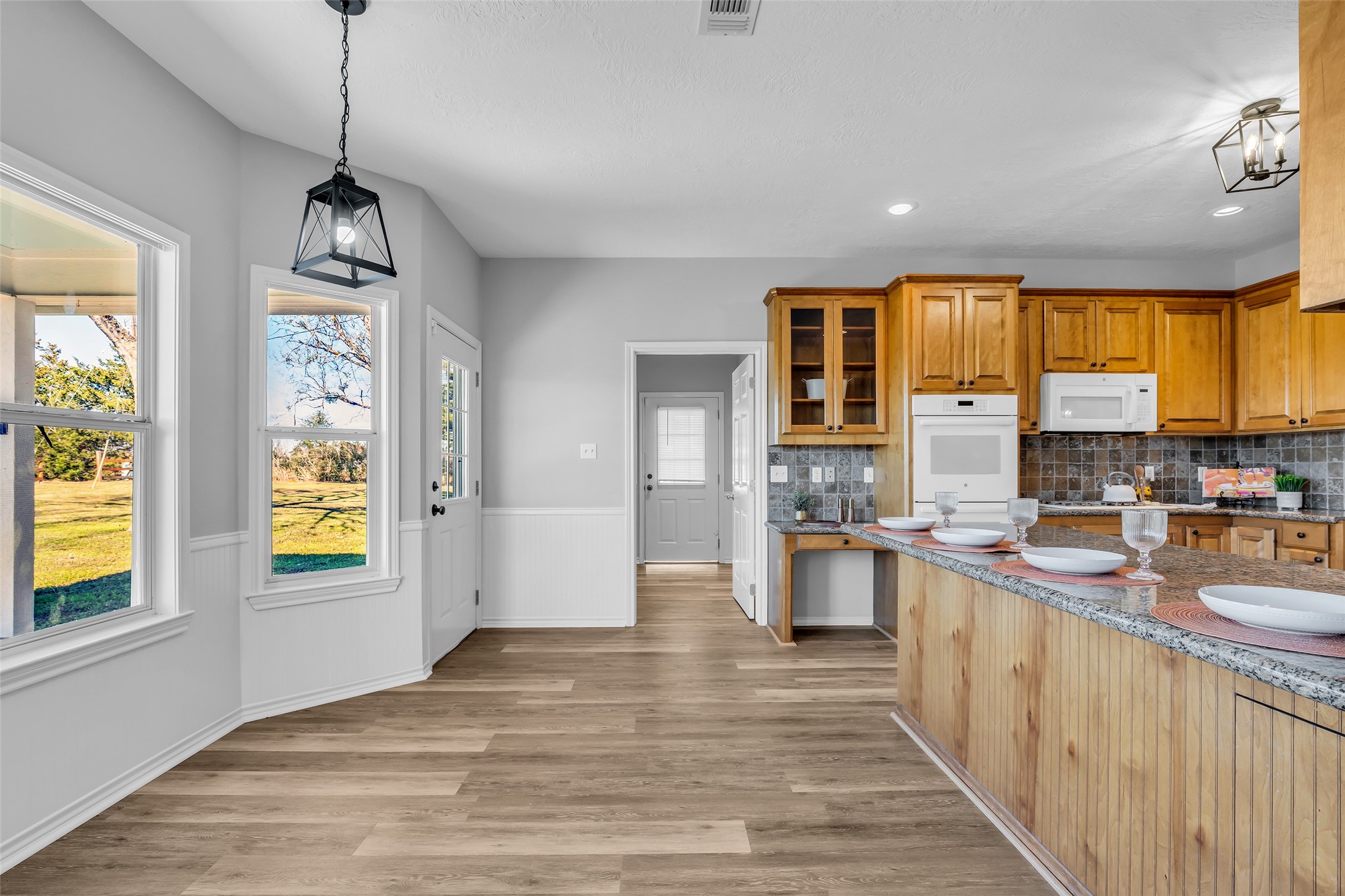 1075 Harrisburg Road Brenham, TX 77833 - Photo 15 of 49 a kitchen with stainless steel appliances granite countertop a sink stove and refrigerator