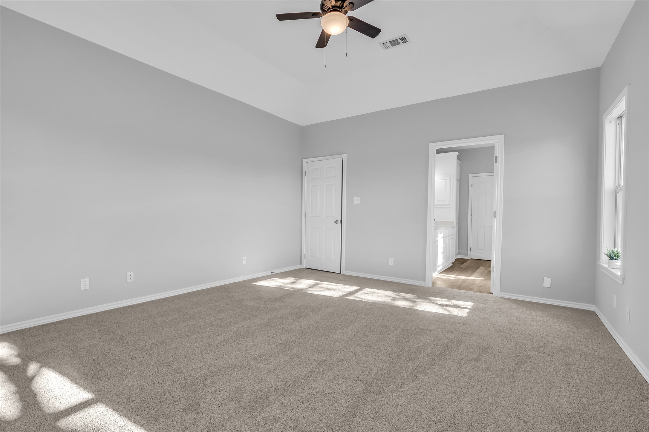 1075 Harrisburg Road Brenham, TX 77833 - Photo 22 of 49 a view of an empty room with a ceiling fan