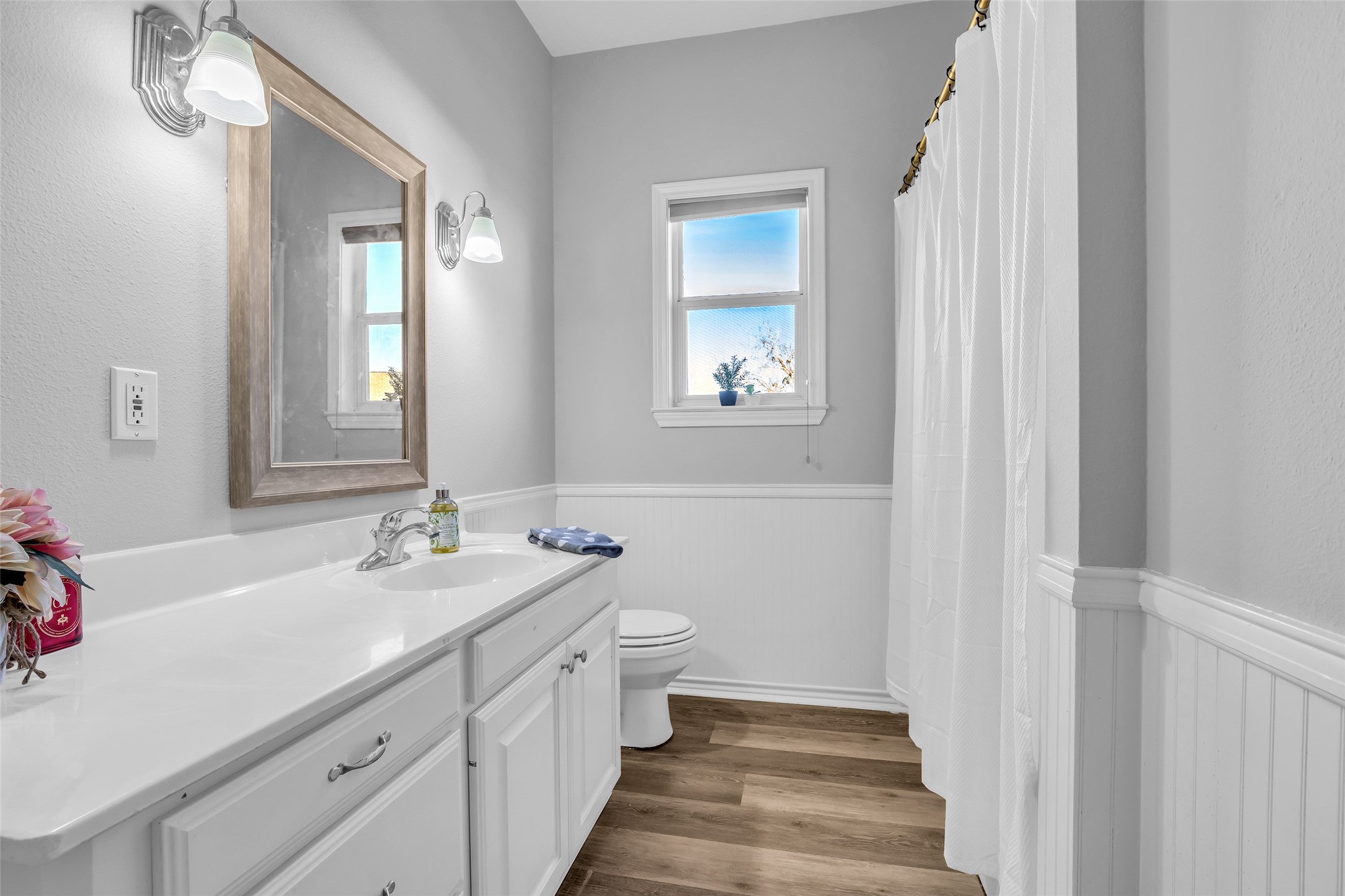 1075 Harrisburg Road Brenham, TX 77833 - Photo 27 of 49 a bathroom with a sink and a mirror