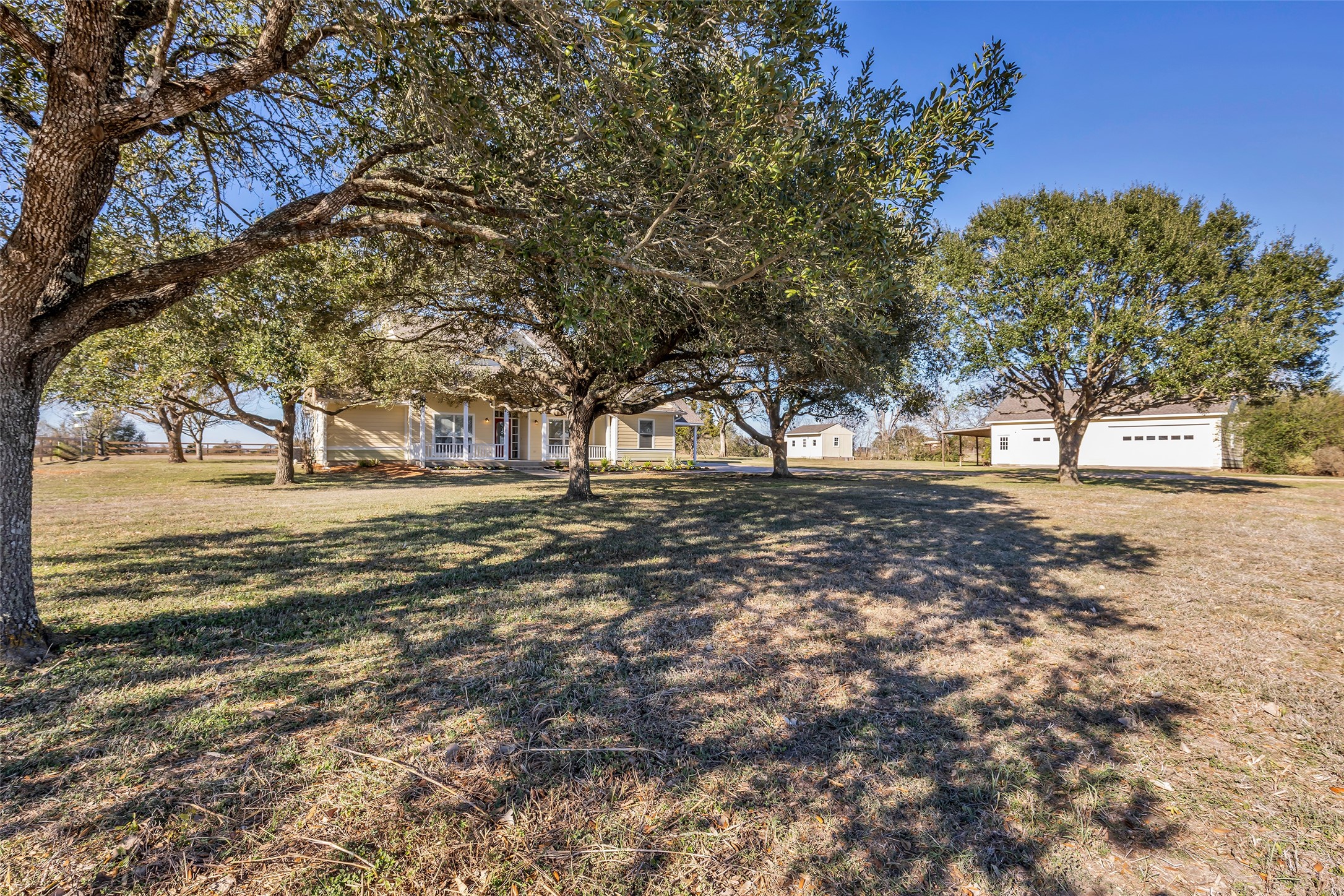 1075 Harrisburg Road Brenham, TX 77833 - Photo 3 of 49 a view of road with large trees