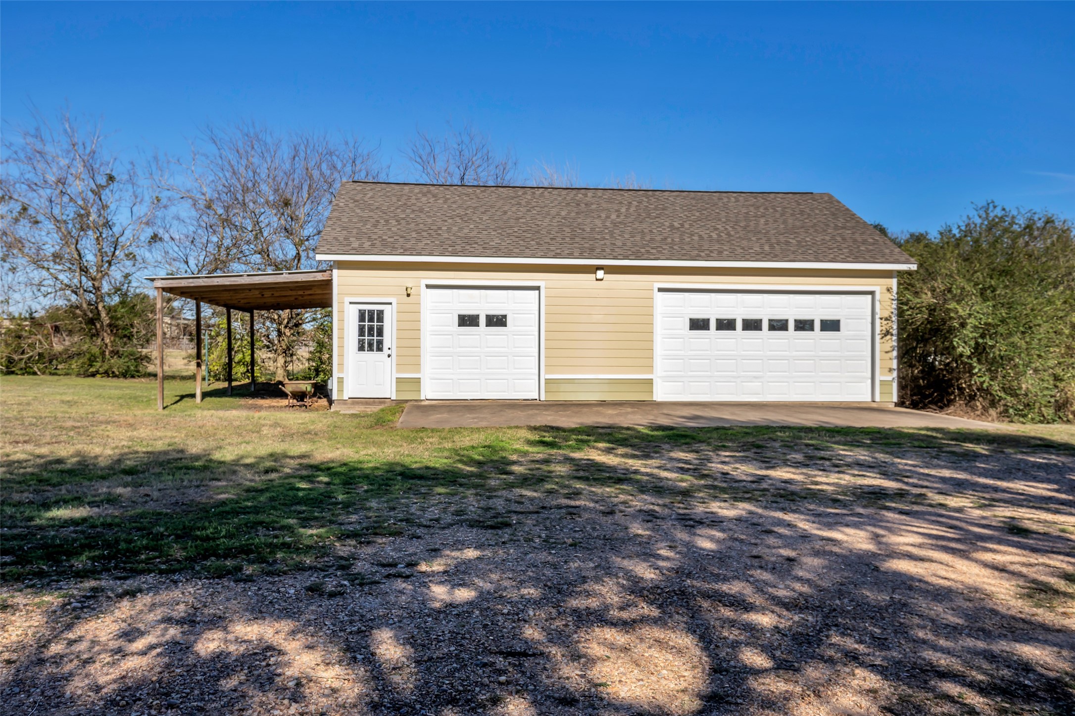 1075 Harrisburg Road Brenham, TX 77833 - Photo 35 of 49 a front view of a house with a yard