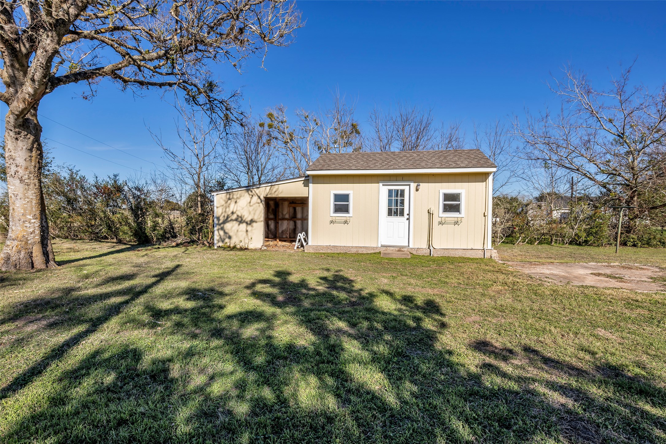 1075 Harrisburg Road Brenham, TX 77833 - Photo 36 of 49 a front view of a house with a yard