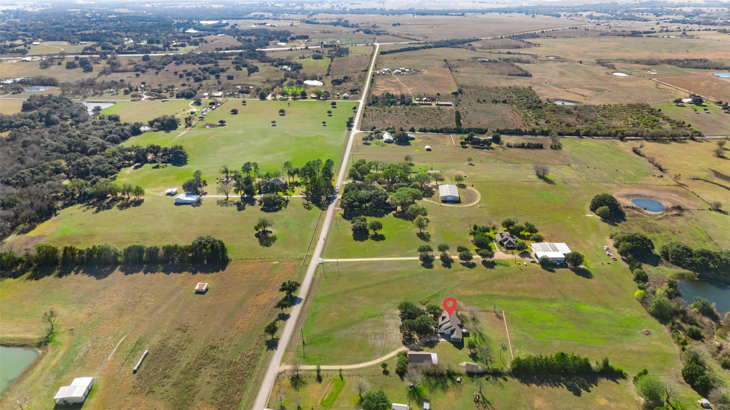 1075 Harrisburg Road Brenham, TX 77833 - Photo 47 of 49 an aerial view of residential houses with outdoor space