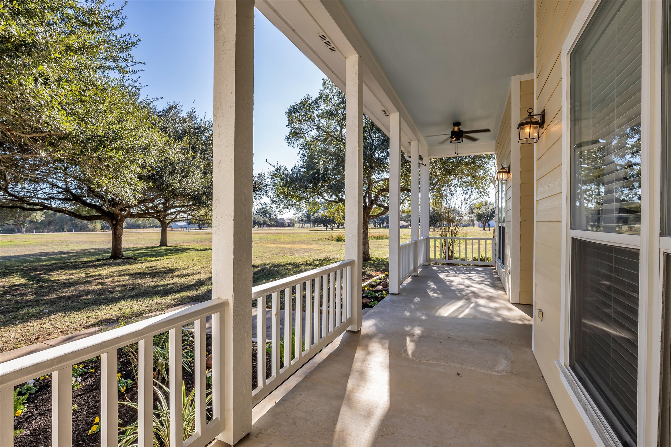 1075 Harrisburg Road Brenham, TX 77833 - Photo 5 of 49 a view of a porch with wooden floor and a floor to ceiling window