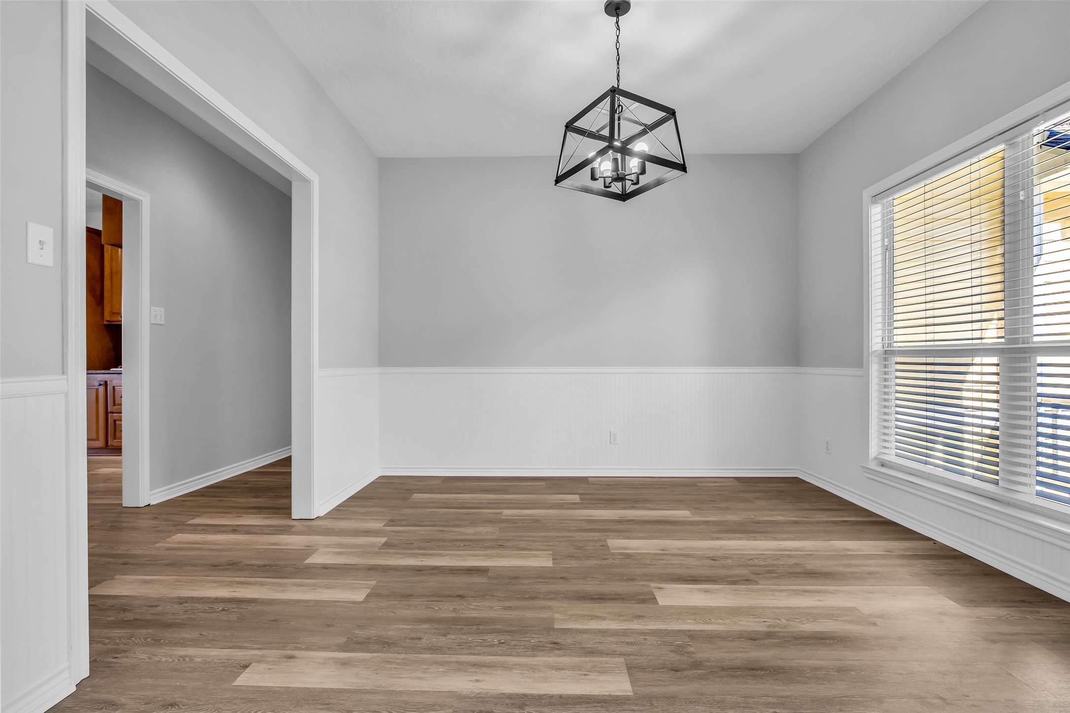1075 Harrisburg Road Brenham, TX 77833 - Photo 8 of 49 a view of a room with wooden floor and window