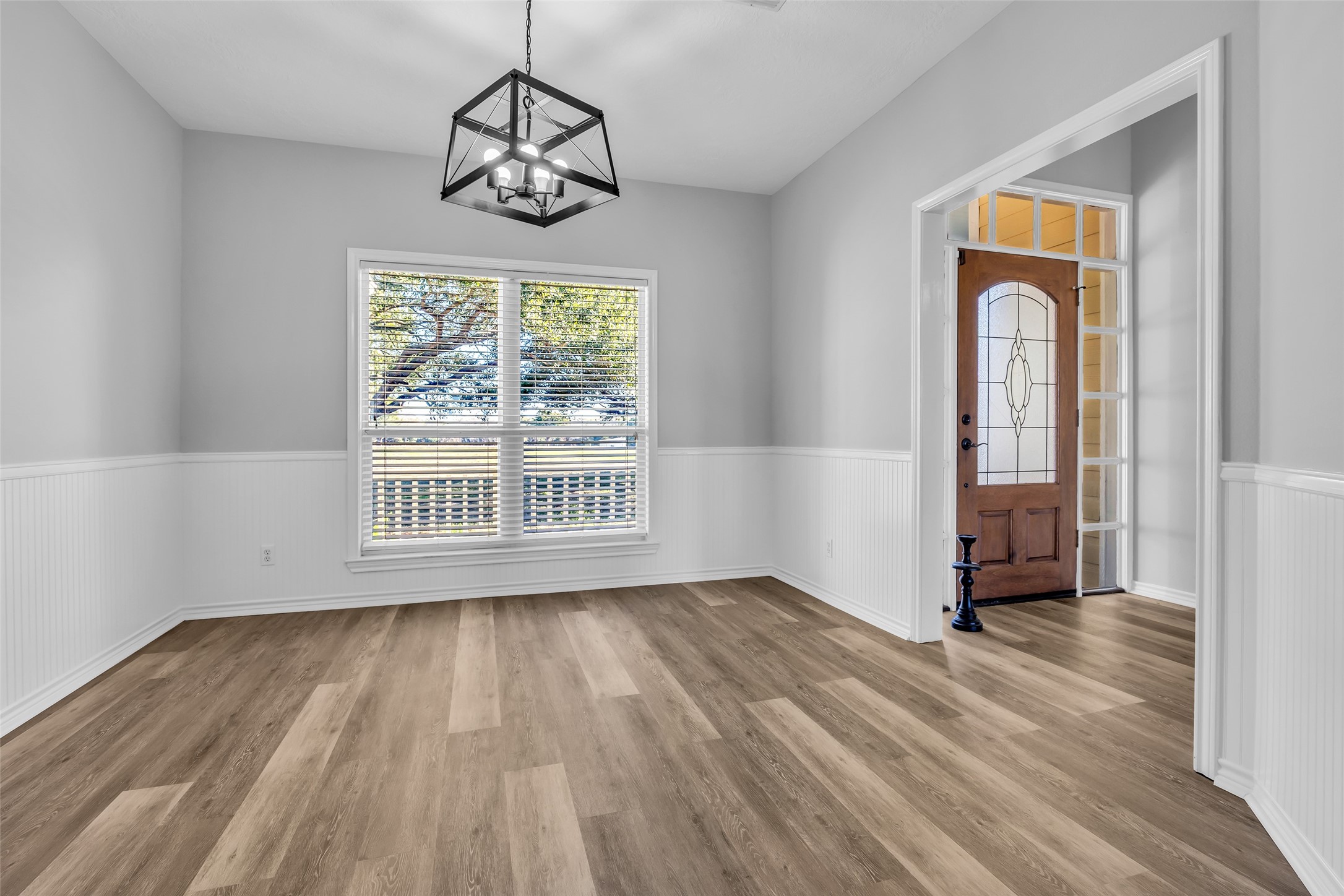 1075 Harrisburg Road Brenham, TX 77833 - Photo 9 of 49 a view of an empty room with wooden floor and a window