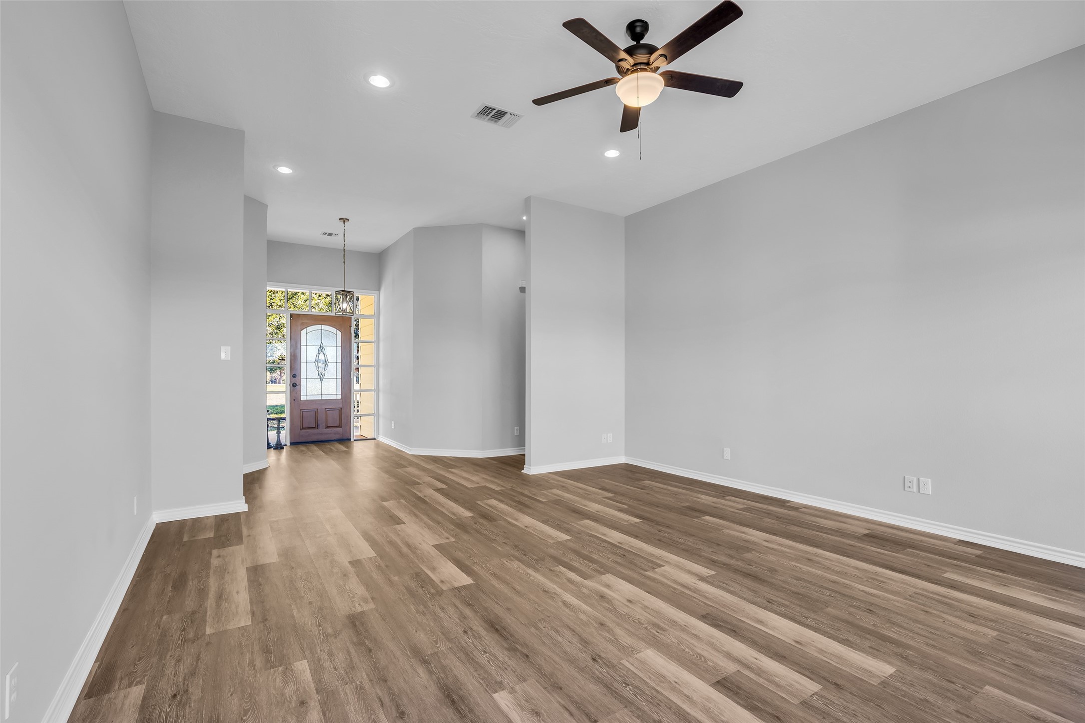 1075 Harrisburg Road Brenham, TX 77833 - Photo 10 of 49 a view of empty room with wooden floor and fan