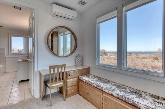 a view of a green field with wooden fence