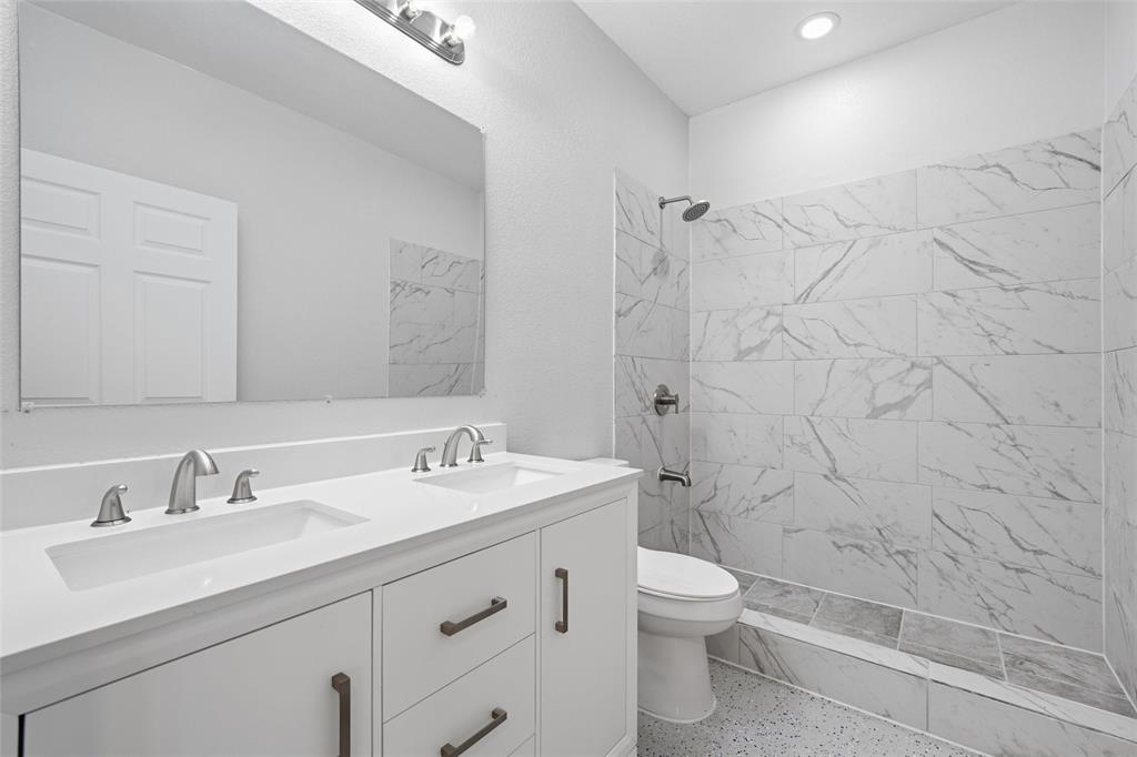 151 Kasberg Road Leroy, TX 76691 - Photo 20 of 40 a bathroom with a sink a toilet and shower