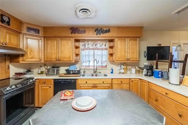 a view of a workspace with furniture and a living room