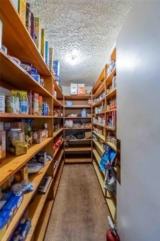 a view of a livingroom with furniture and wooden floor