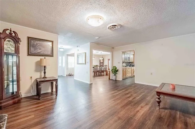 a bed room with furniture and wooden floor