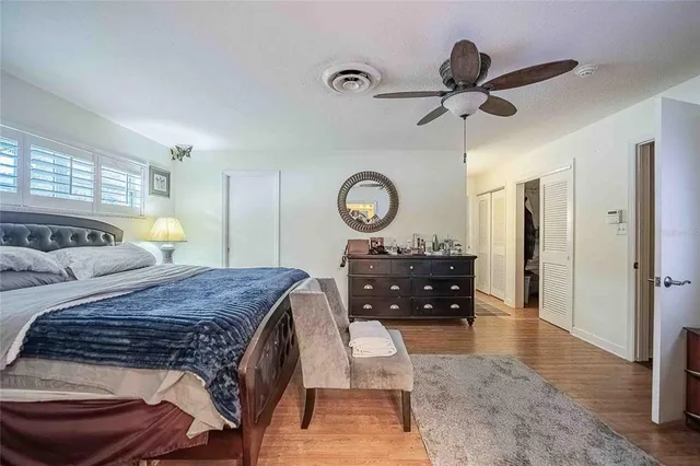 a bathroom with a sink mirror and toilet