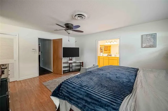 a kitchen with a sink and chairs