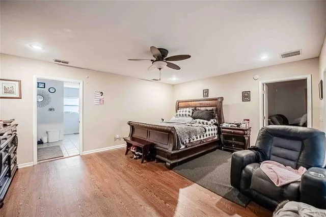 a living room with furniture a ceiling fan and a window