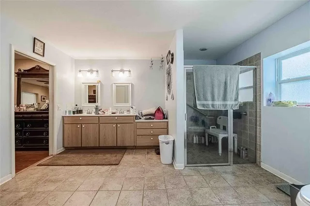 a room with lots of chairs and mirrors