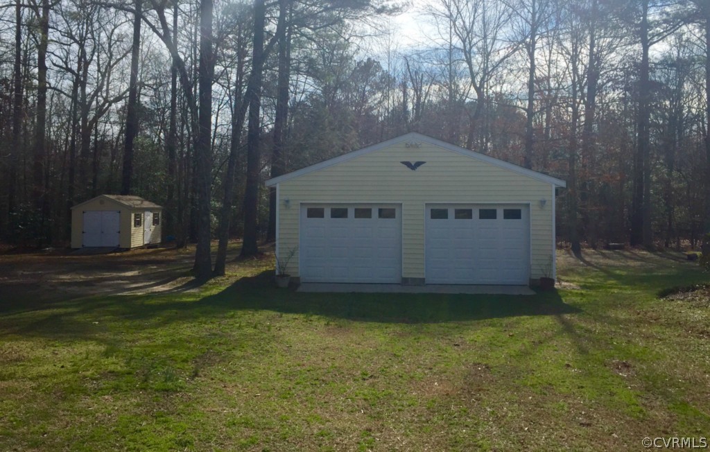 17941 Loving Union Road Disputanta, VA 23842 - Photo 13 of 17 a view of a house with a yard