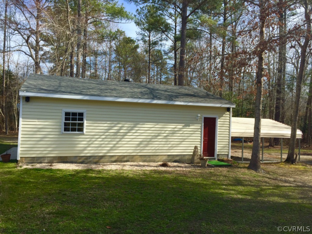 17941 Loving Union Road Disputanta, VA 23842 - Photo 14 of 17 a view of a house with a yard