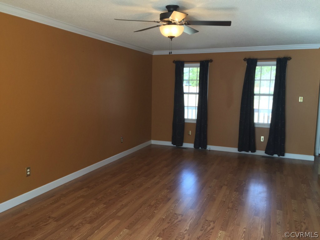 17941 Loving Union Road Disputanta, VA 23842 - Photo 7 of 17 a view of an empty room with wooden floor and a window