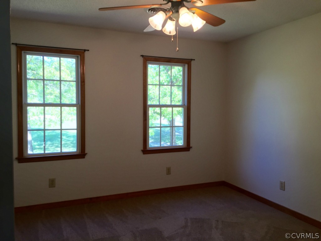 17941 Loving Union Road Disputanta, VA 23842 - Photo 9 of 17 an empty room with a window
