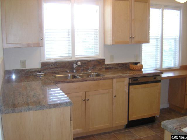 2390 Watt Street Reno, NV 89509 - Photo 3 of 9 a kitchen with a sink a window and cabinets