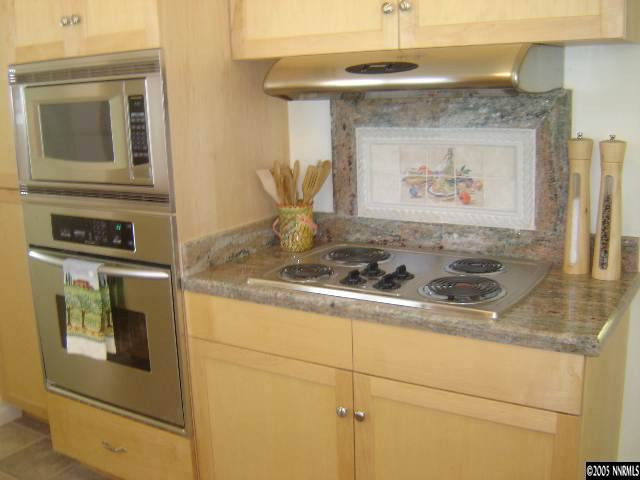 2390 Watt Street Reno, NV 89509 - Photo 4 of 9 a stove top oven sitting inside of a kitchen