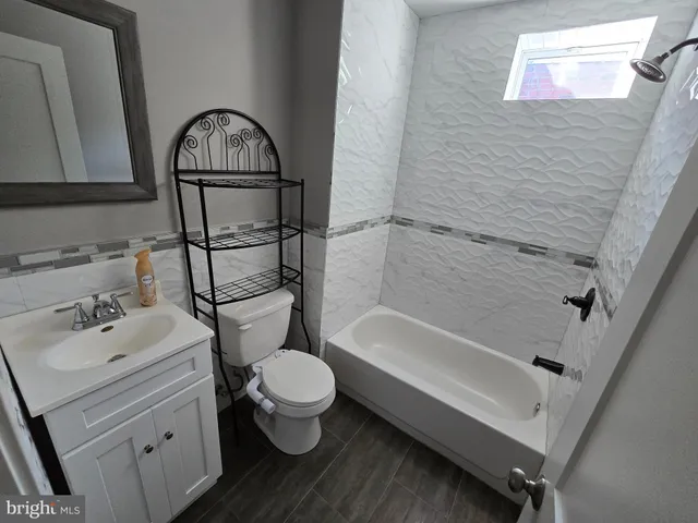 a view of storage and utility room with washer and dryer