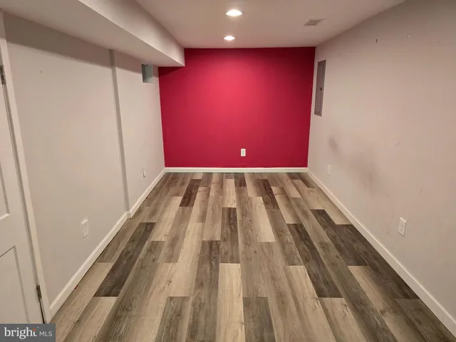 a view of a room with wooden floor and staircase